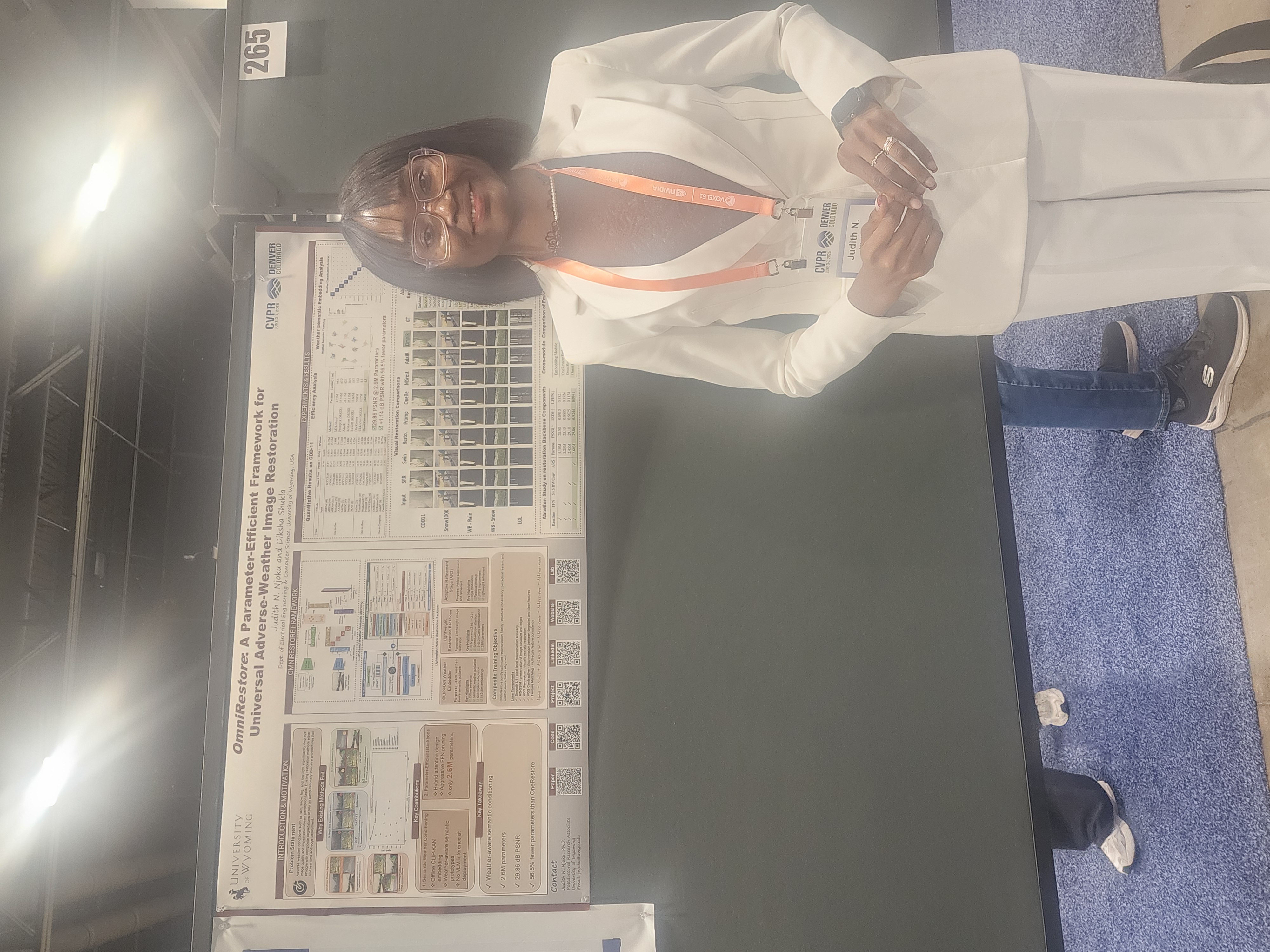 Judith Njoku-Vowels beside the OmniRestore poster at CVPR 2026